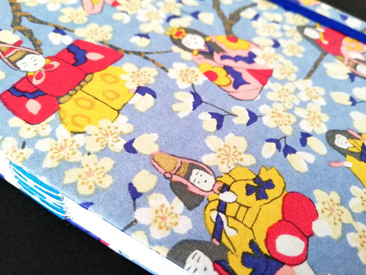 Carnet allongé en papier artisanal à motif floral coloré, création artisanale, produit éco-responsable, œuvre unique.